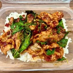 Pork stir-fry with basil and dried chilies (Pui Mek restaurant's special recipe).