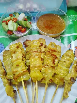 20 skewers of pork satay, enough for one person.