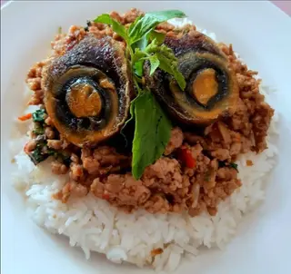 Stir-fried minced pork with basil and century egg.