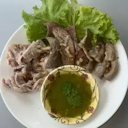 Mixed pork platter with dipping sauce.