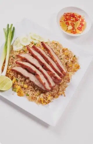 Fried rice with grilled pork neck and egg.