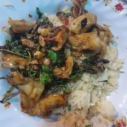 Crispy chicken with basil, served over rice.