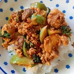 Chicken stir-fried with curry paste and eggplant, served over rice.