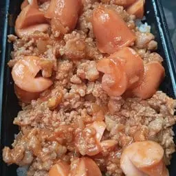 Stir-fried minced pork and sausage with tomato sauce, served over rice.