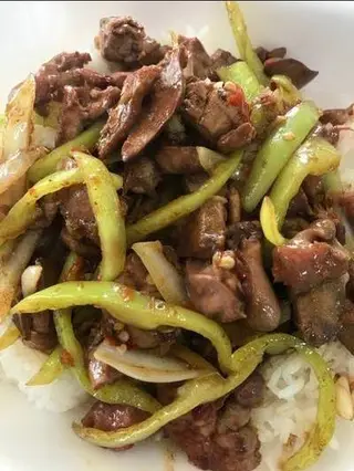 Rice topped with stir-fried mild chili peppers, which ingredient?