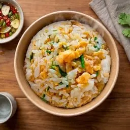 Rice mixed with two fried eggs.
