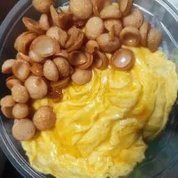 Rice with creamy scrambled eggs and crispy sausage.