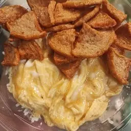 Rice with creamy scrambled eggs and fried pork sausage