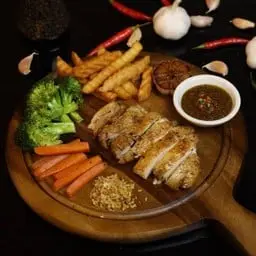 Crispy skin chicken steak with roasted chili and salt sauce.