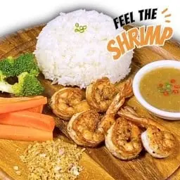 Shrimp steak over rice with roasted chili and salt sauce.