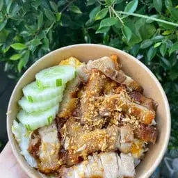 Rice with creamy scrambled eggs, crispy pork, and garlic.